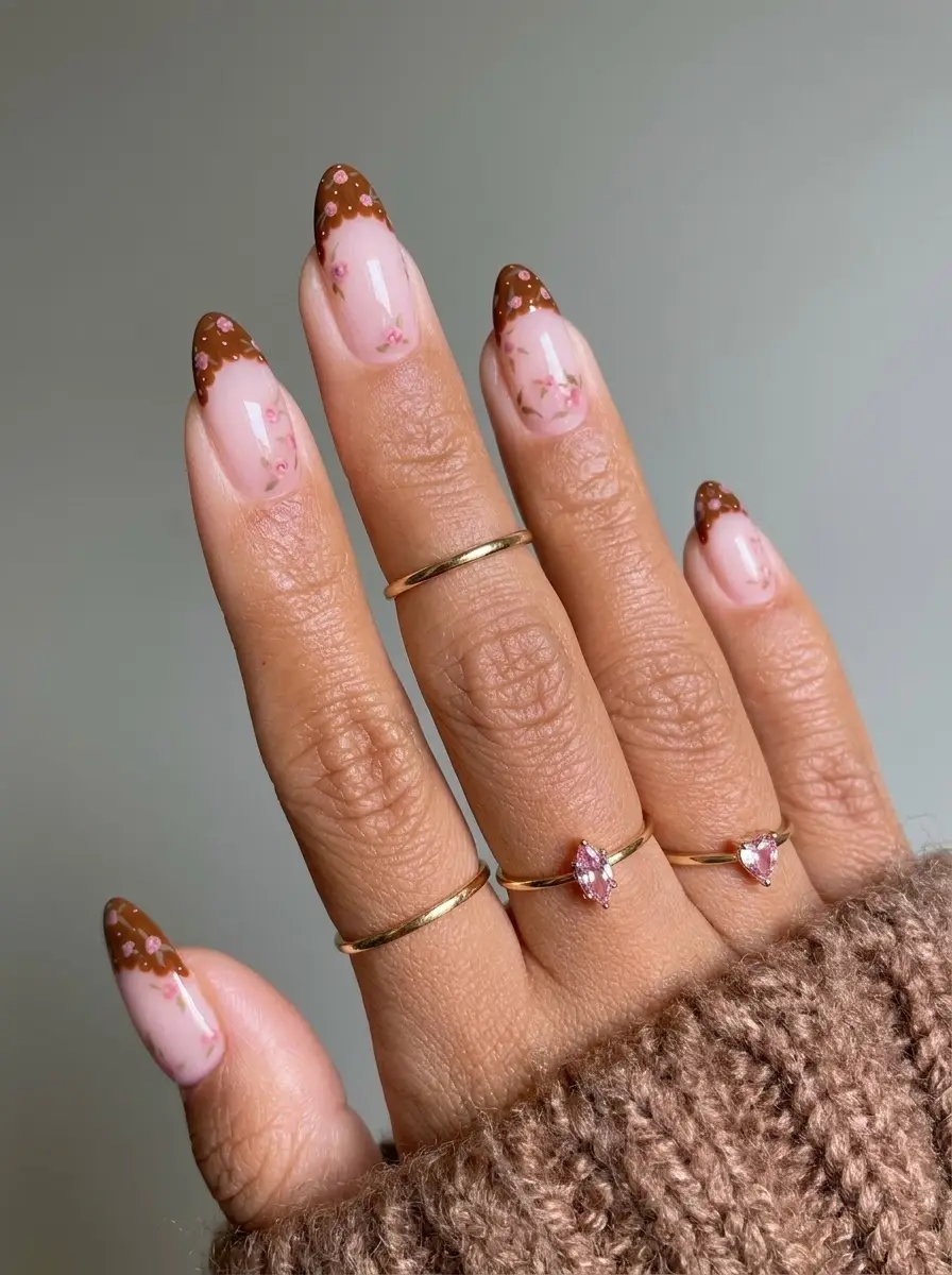 Brown French Christmas Nails With Pink Florals - Milky blush nails with scalloped chocolate-brown French tips and pale pink flowers